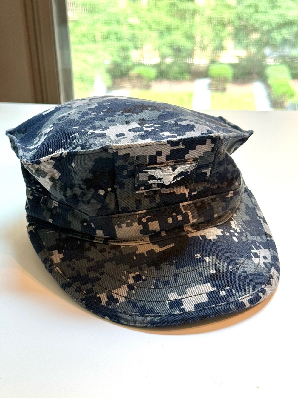 U.S. Navy blue digital camo 8-point utility hat features Captain’s rank insignia